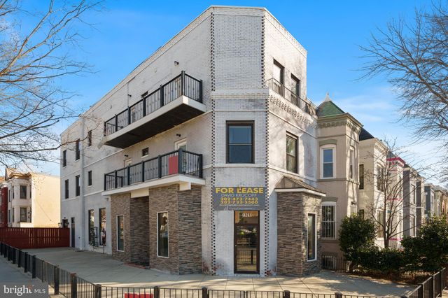 a view of a street with buildings