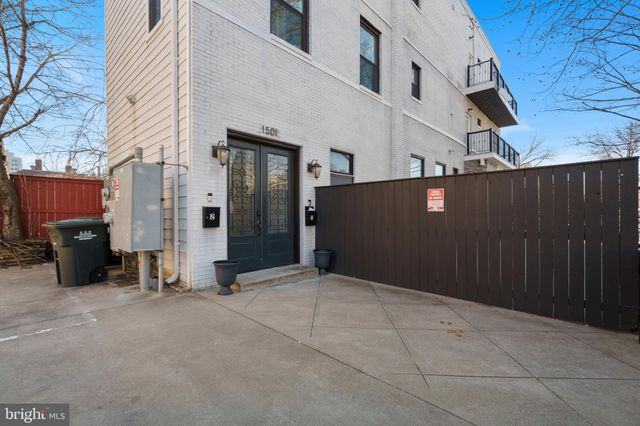 a front view of a building with a yard