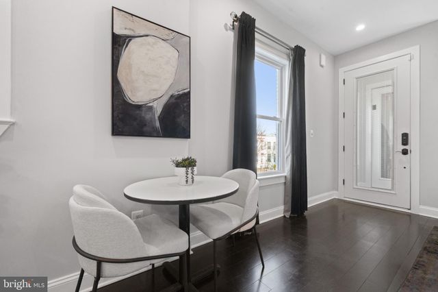 a view of a room that has a table and chair in it