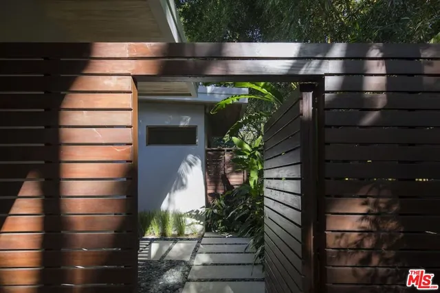 a view of an outdoor sitting area with furniture