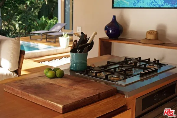 a bed sitting in a bedroom next to a lamp