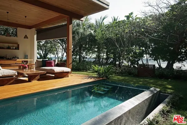 a view of swimming pool with a patio