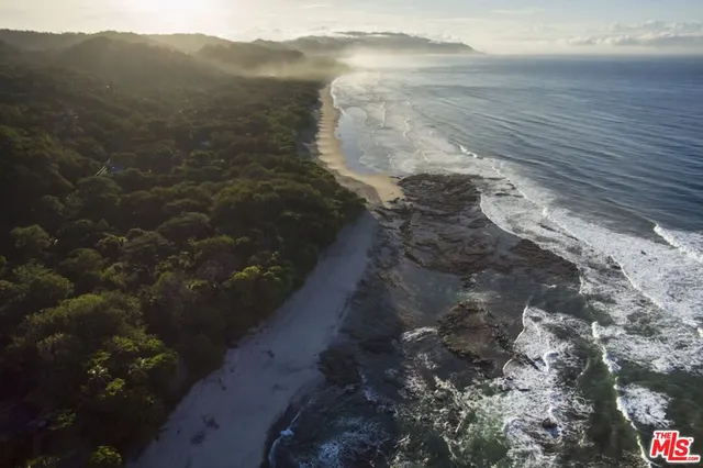 a view of kitchen with furniture and large window
