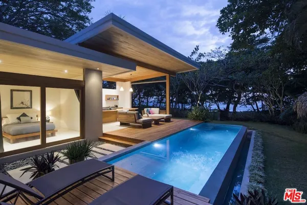 a view of a swimming pool with a patio