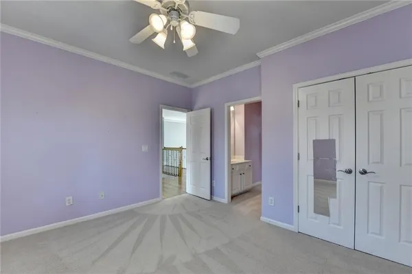 a view of empty room with wooden floor and windows