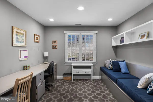 a bedroom with furniture and a window