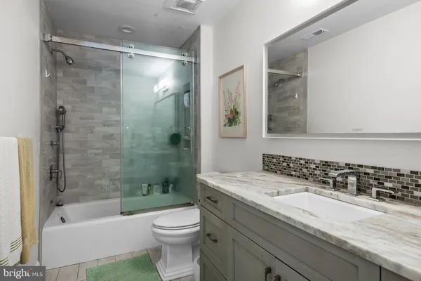 a bathroom with a sink and a shower