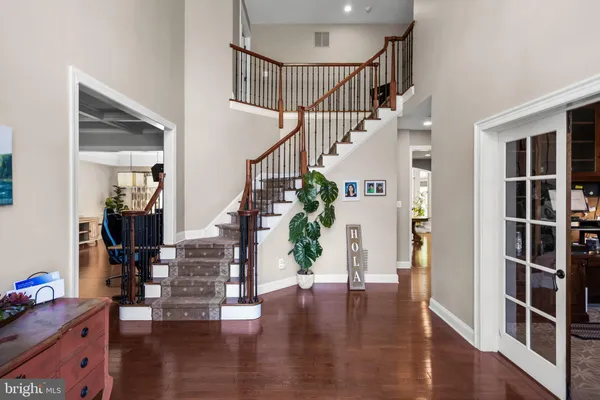 a view of an entryway with wooden floor and door