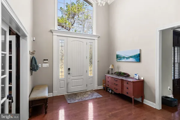 a view of an entryway with wooden floor