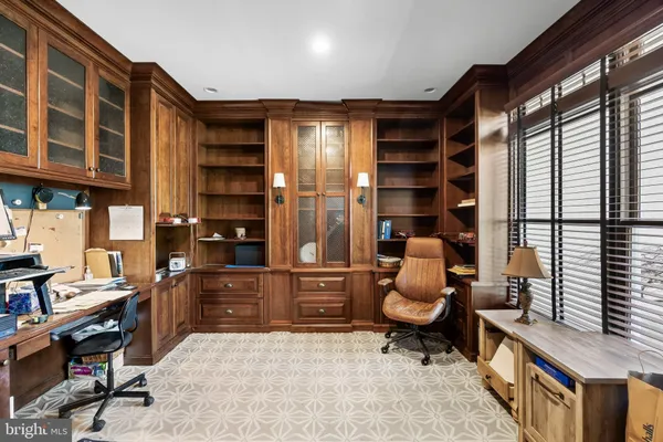 a view of workspace with wooden floor and windows