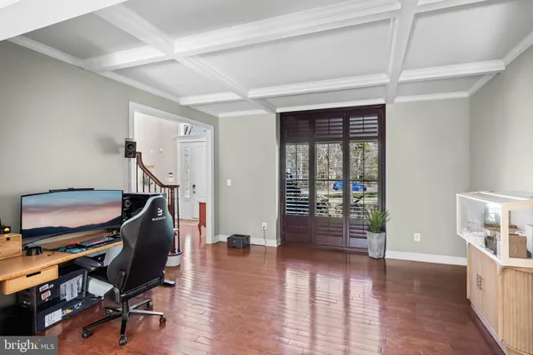 a large kitchen with stainless steel appliances granite countertop a stove a sink and a wooden floors