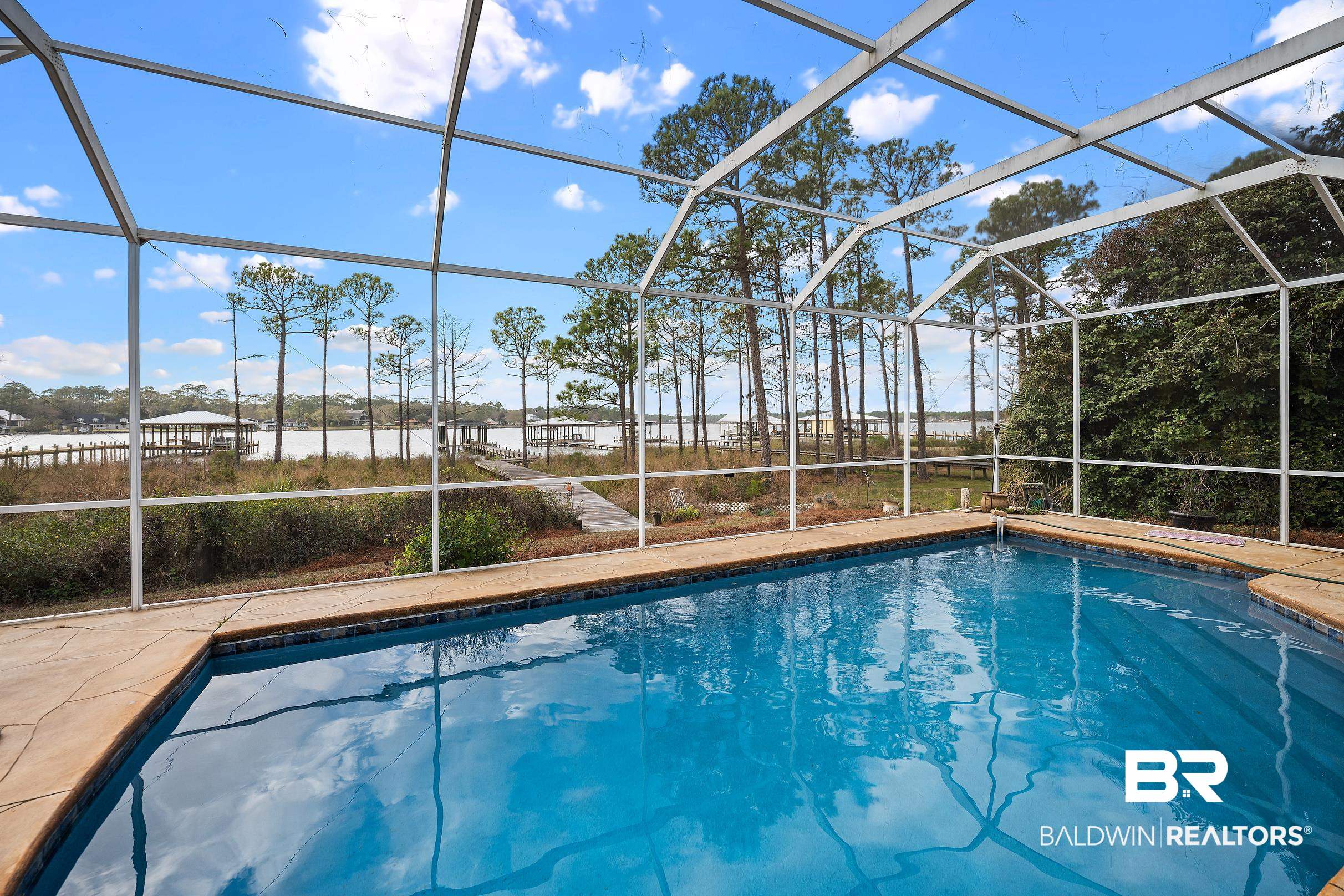 8591 Bay Harbor Road Elberta, AL 36530 - Photo 11 of 56 Swimming pool featuring a sunroom and a lanai