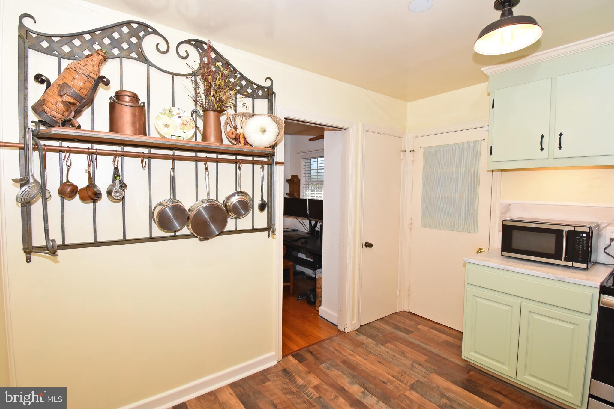 30223 Mt Vernon Road Princess Anne, MD 21853 - Photo 12 of 53 a kitchen with a refrigerator and a stove