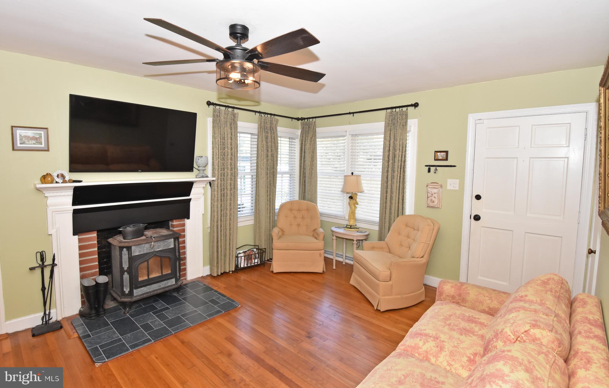 30223 Mt Vernon Road Princess Anne, MD 21853 - Photo 14 of 53 a living room with furniture and a flat screen tv
