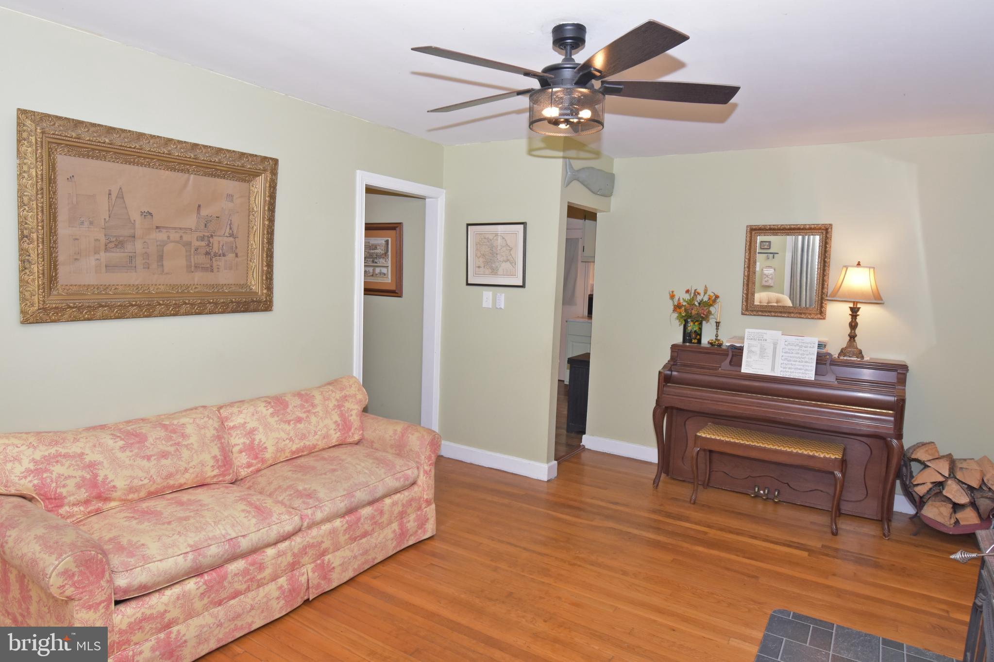 30223 Mt Vernon Road Princess Anne, MD 21853 - Photo 16 of 53 a bedroom with a bed and a chandelier