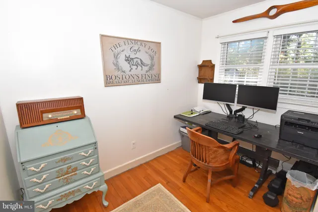 a workspace with furniture and window