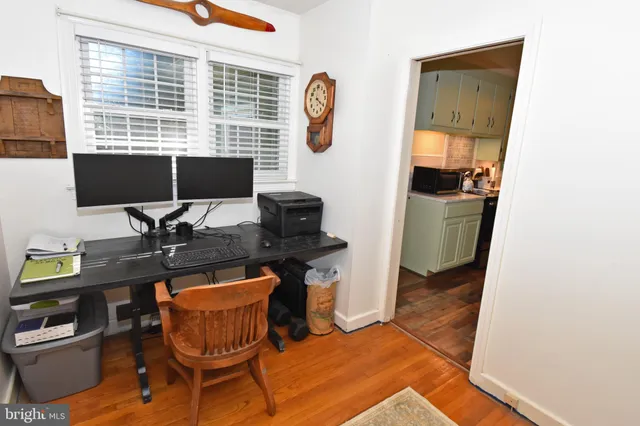 a workspace with furniture and window