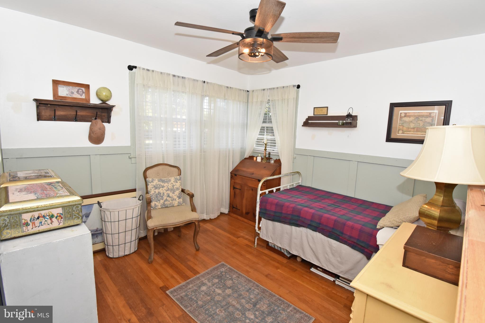30223 Mt Vernon Road Princess Anne, MD 21853 - Photo 26 of 53 a bedroom with furniture and a lamp