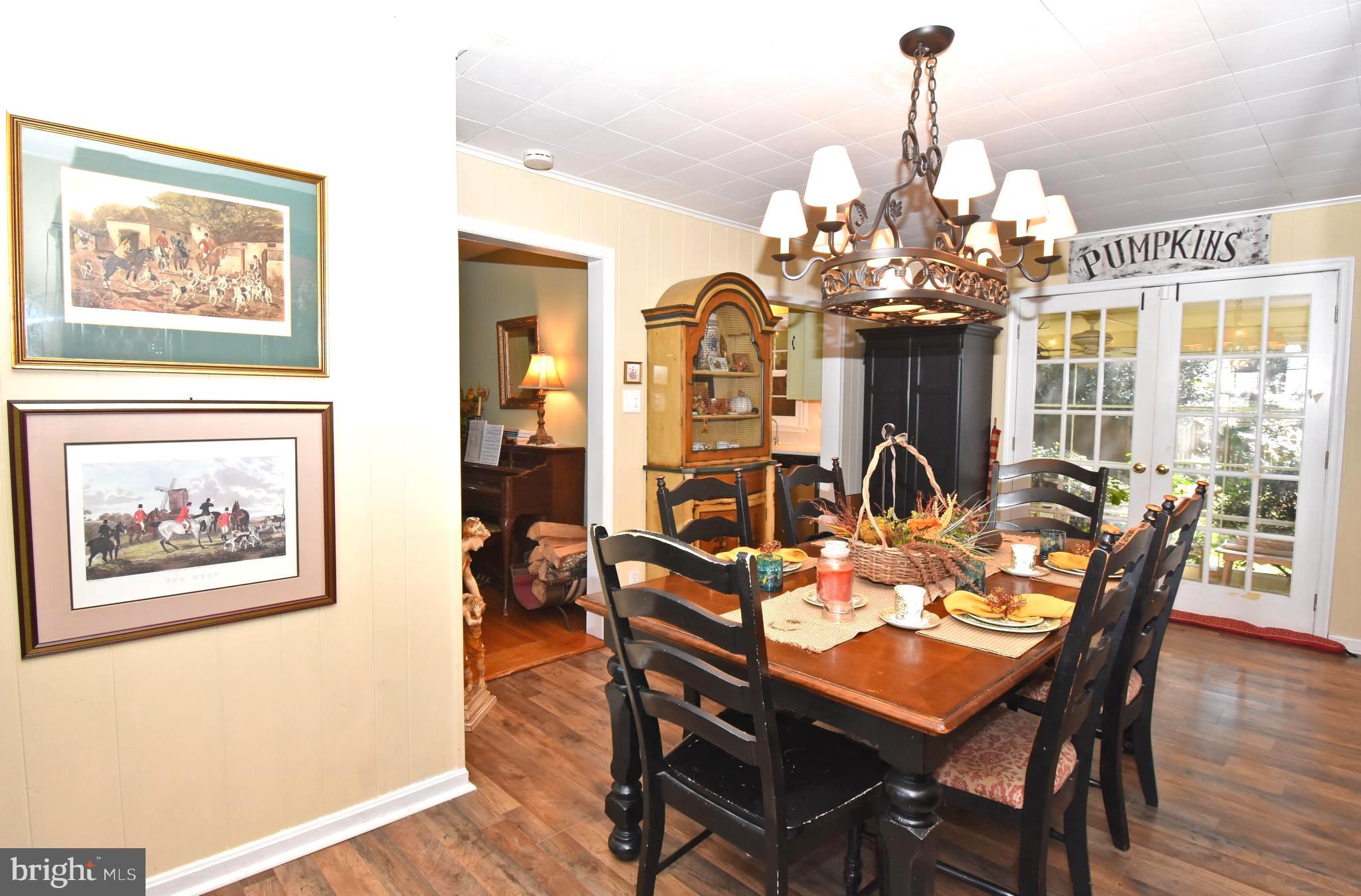 30223 Mt Vernon Road Princess Anne, MD 21853 - Photo 5 of 53 a view of a dining room with furniture window and wooden floor
