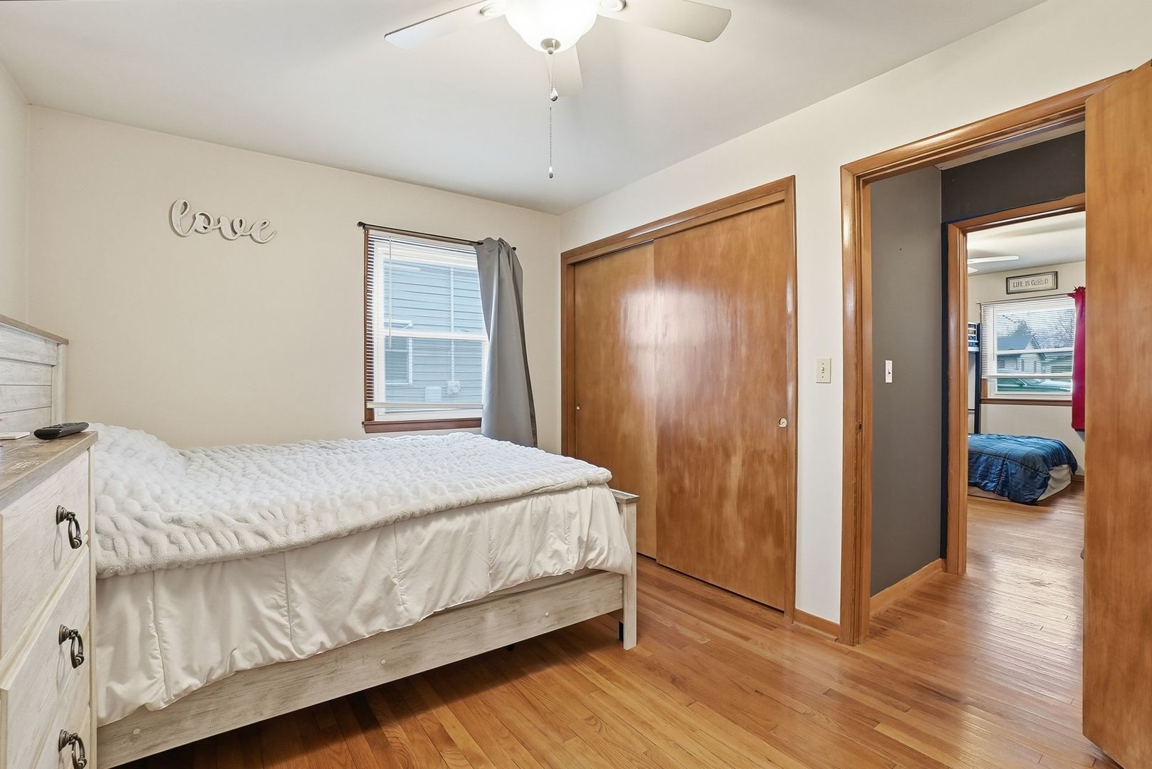 101 South 4080 W Road Kankakee, IL 60901 - Photo 16 of 21 a bedroom with a bed and wooden floor