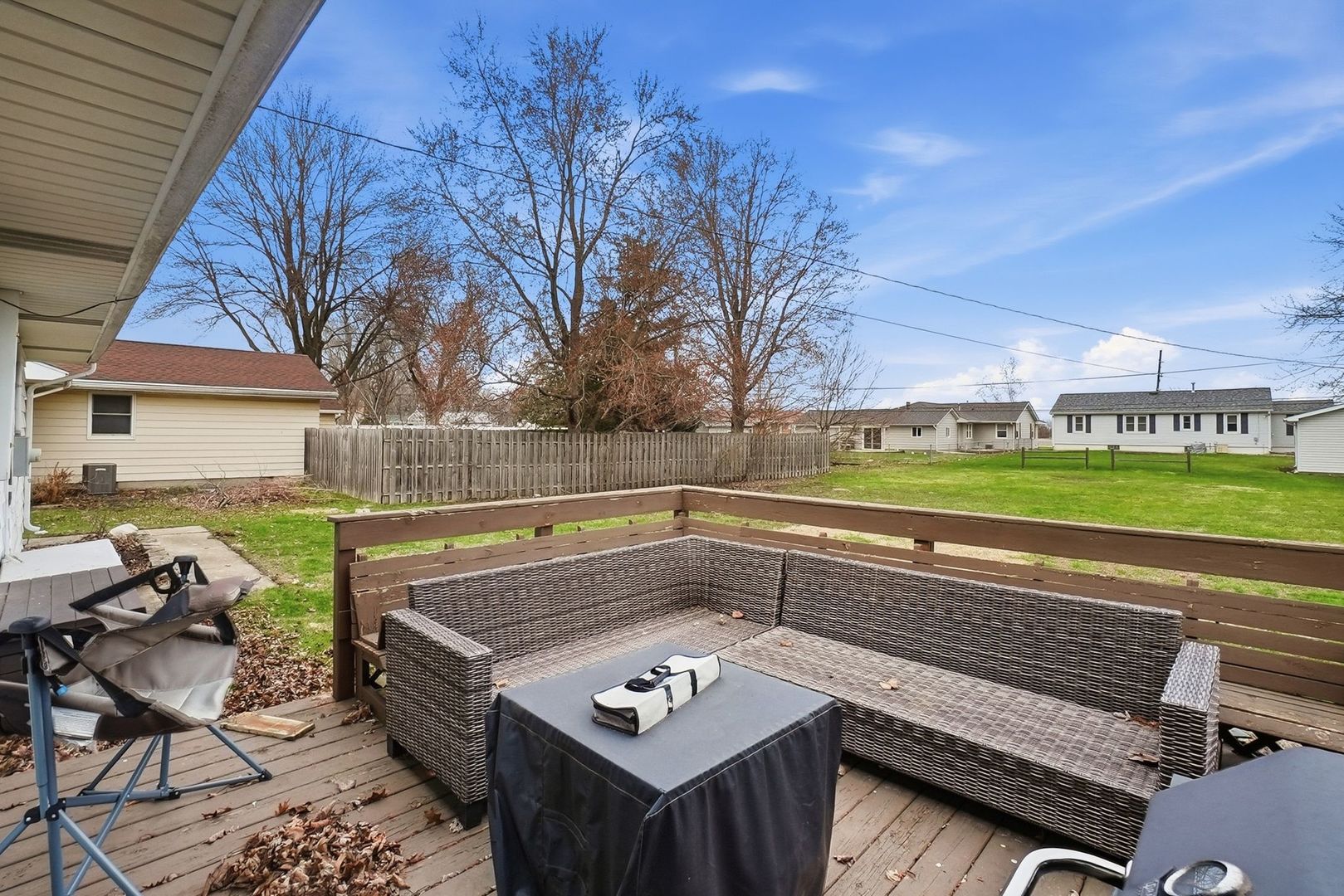 101 South 4080 W Road Kankakee, IL 60901 - Photo 18 of 21 a view of a chairs and table on the deck in front of house