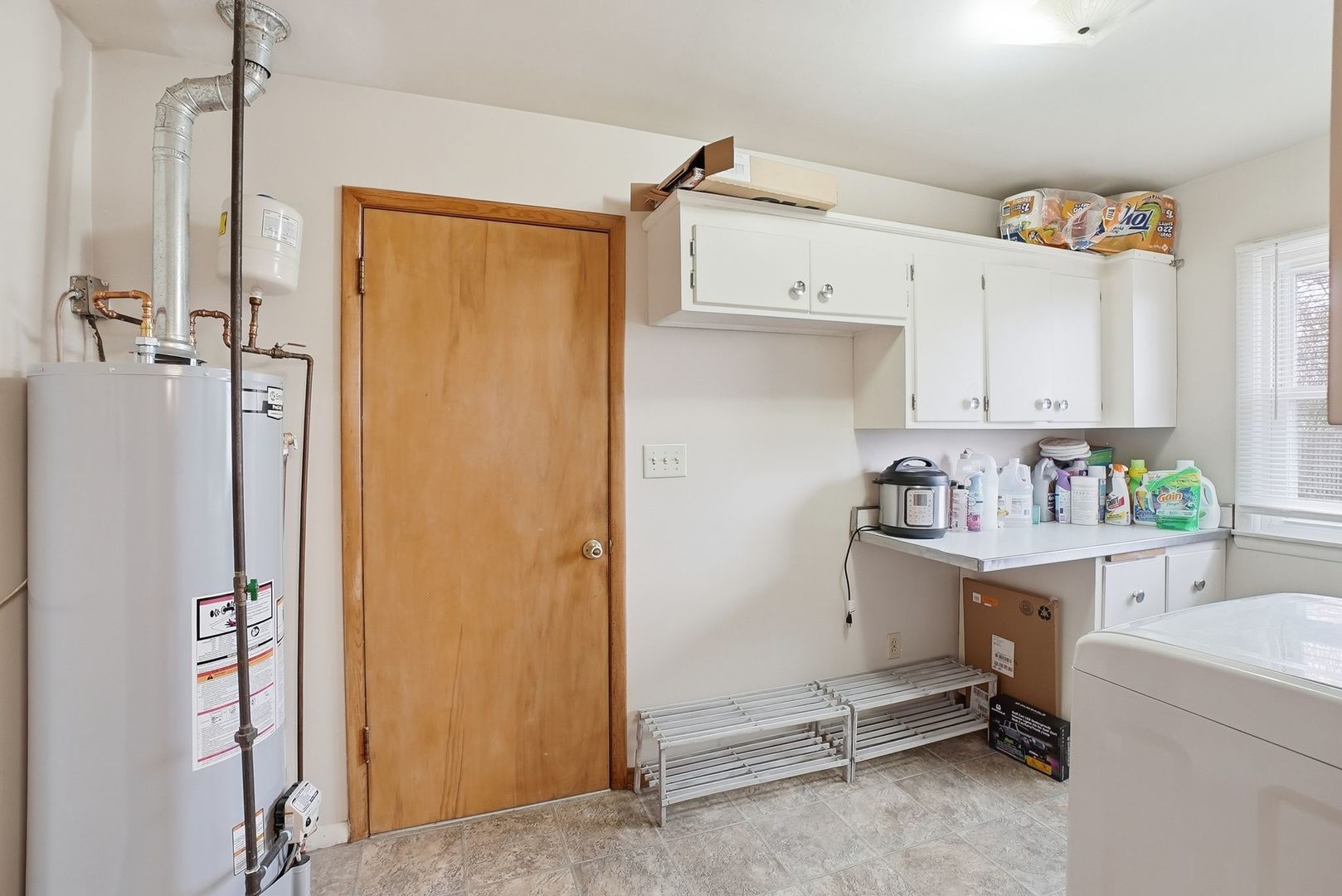 101 South 4080 W Road Kankakee, IL 60901 - Photo 8 of 21 a view of a kitchen with fridge and workspace