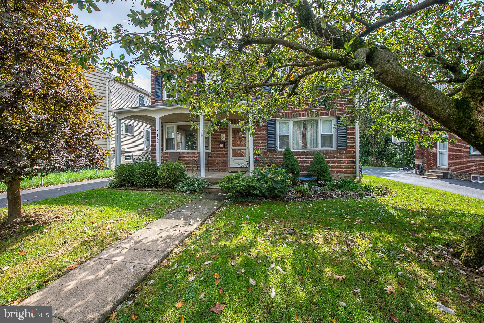1454 Manoa Road Wynnewood, PA 19096 - Photo 1 of 41 a front view of a house with garden
