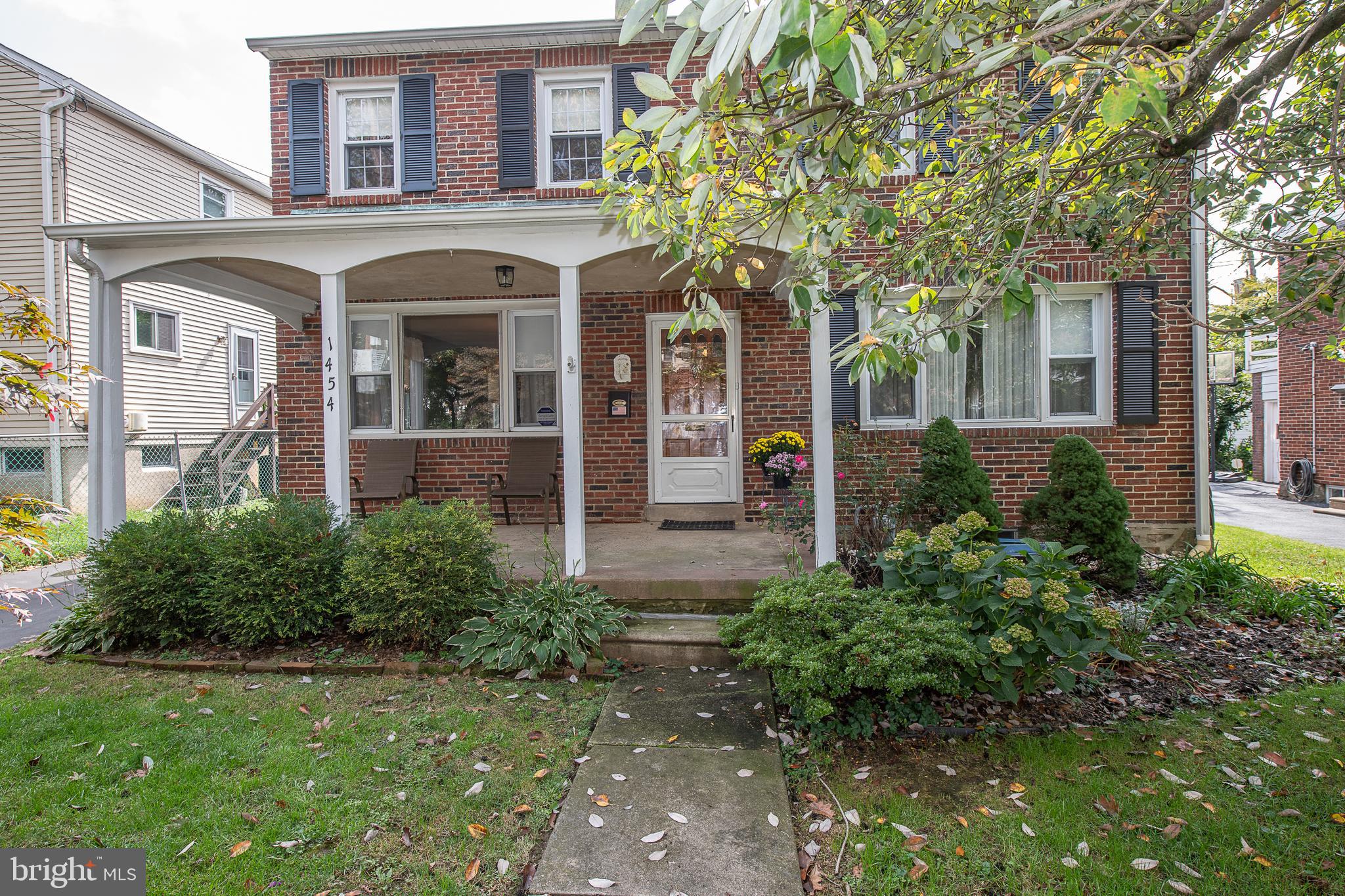 1454 Manoa Road Wynnewood, PA 19096 - Photo 2 of 41 front view of a house with a small yard