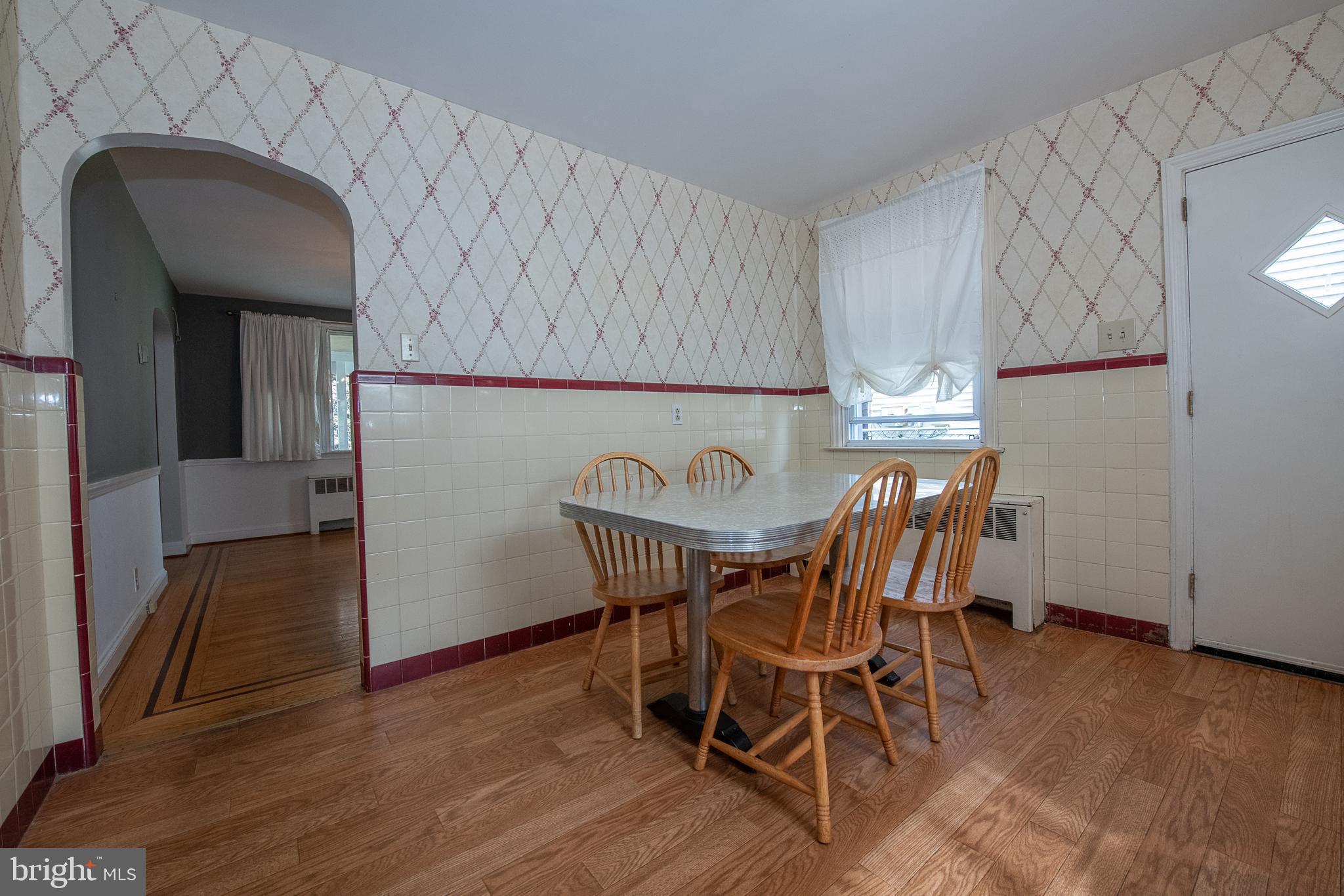 1454 Manoa Road Wynnewood, PA 19096 - Photo 12 of 41 a view of a dining room with furniture and wooden floor