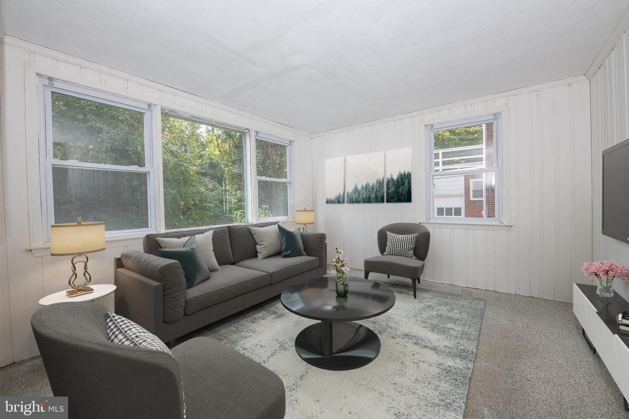 1454 Manoa Road Wynnewood, PA 19096 - Photo 13 of 41 a living room with furniture and a large window