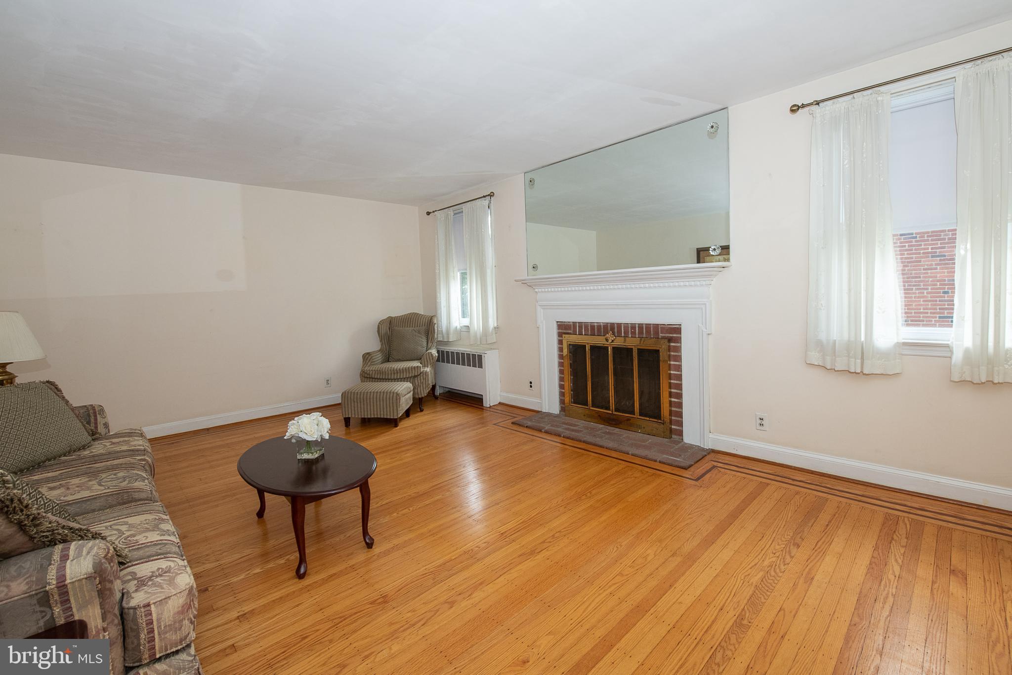 1454 Manoa Road Wynnewood, PA 19096 - Photo 15 of 41 a living room with furniture and a fireplace