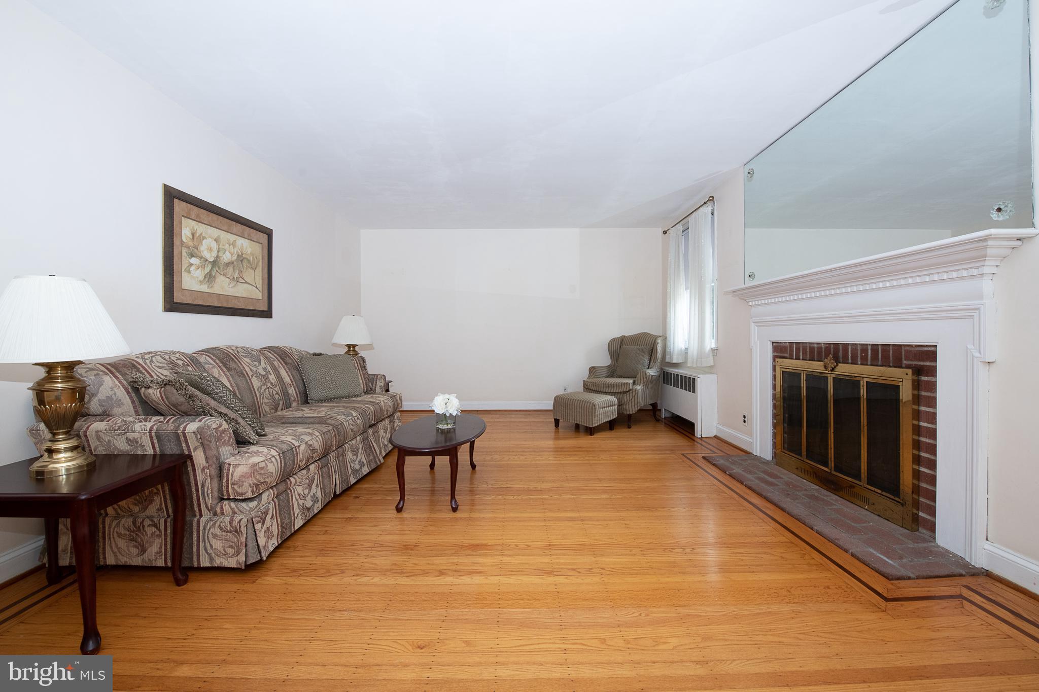 1454 Manoa Road Wynnewood, PA 19096 - Photo 17 of 41 a living room with furniture and a fireplace