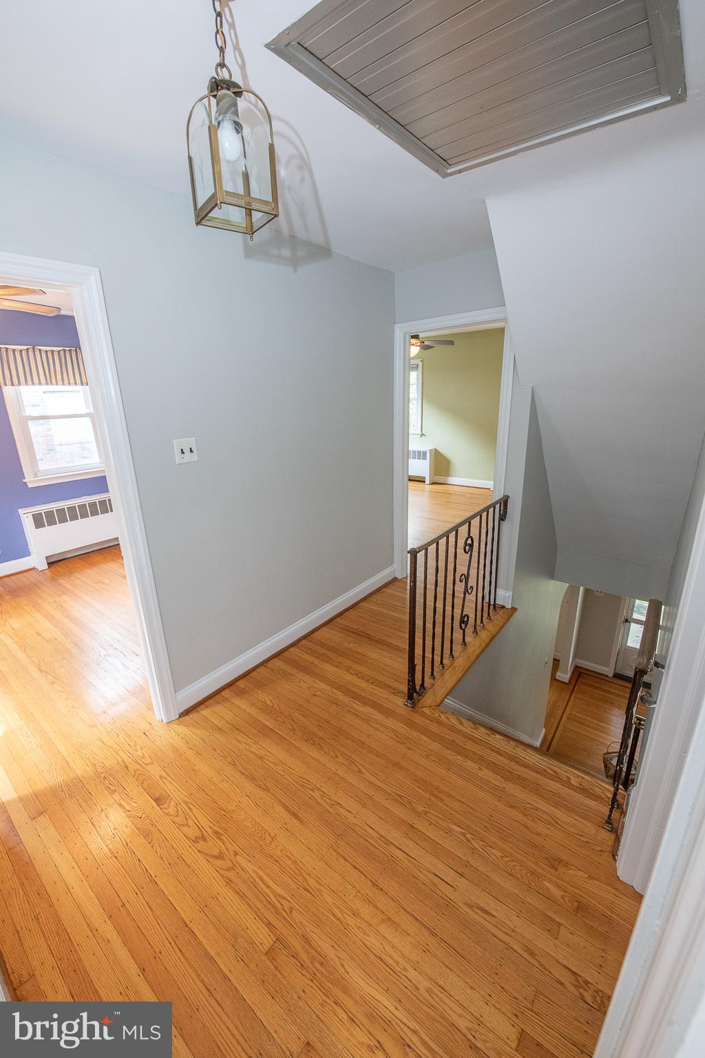 1454 Manoa Road Wynnewood, PA 19096 - Photo 19 of 41 a view of a livingroom with wooden floor and chandelier