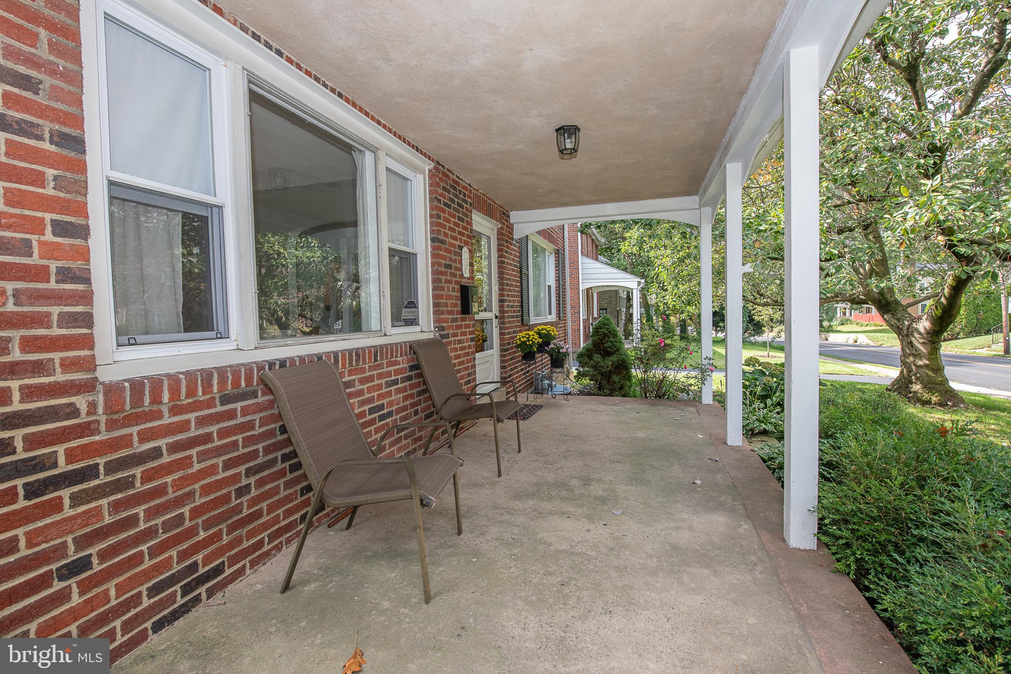 1454 Manoa Road Wynnewood, PA 19096 - Photo 3 of 41 a view of a house with backyard and porch