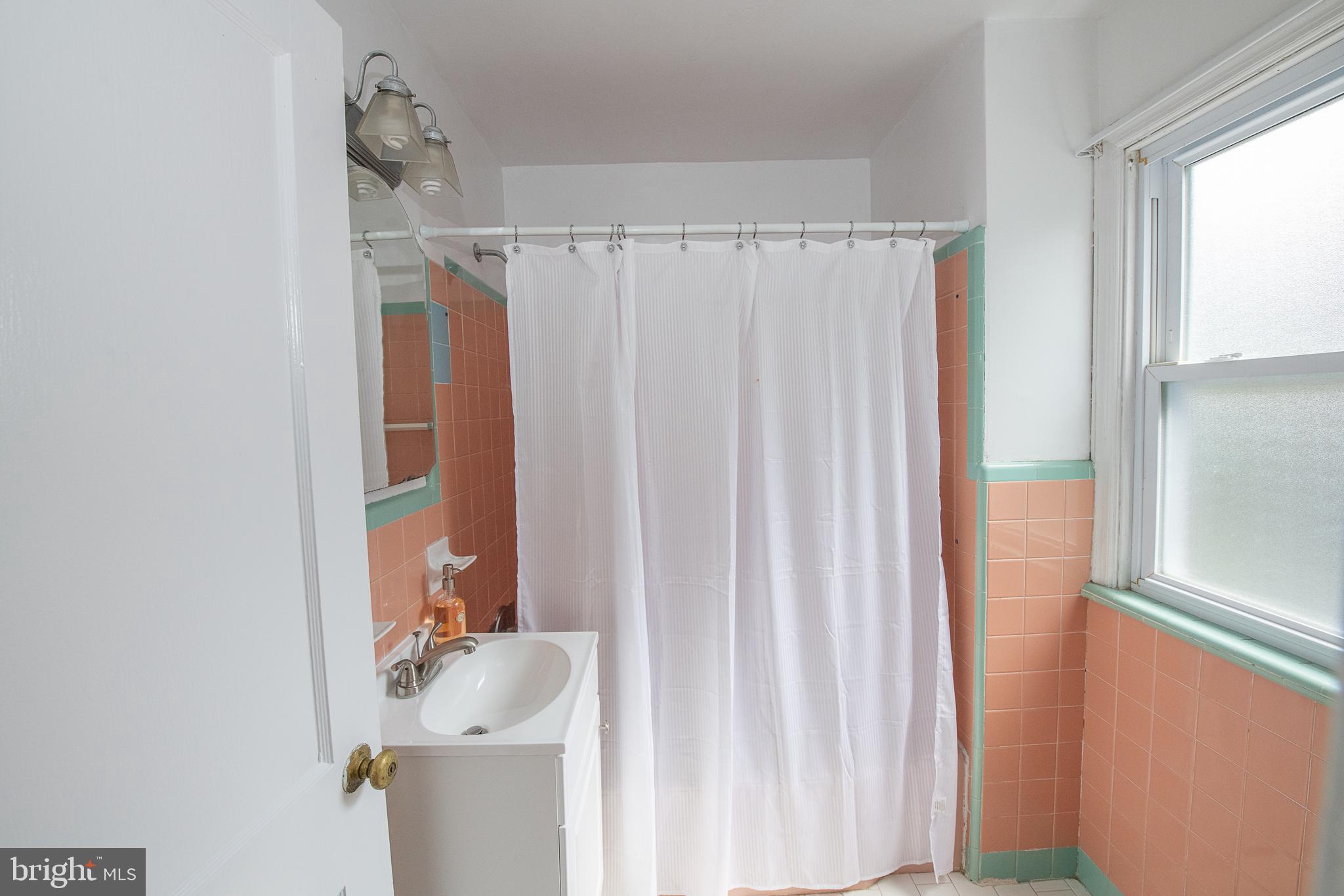 1454 Manoa Road Wynnewood, PA 19096 - Photo 22 of 41 a bathroom with a sink toilet and shower