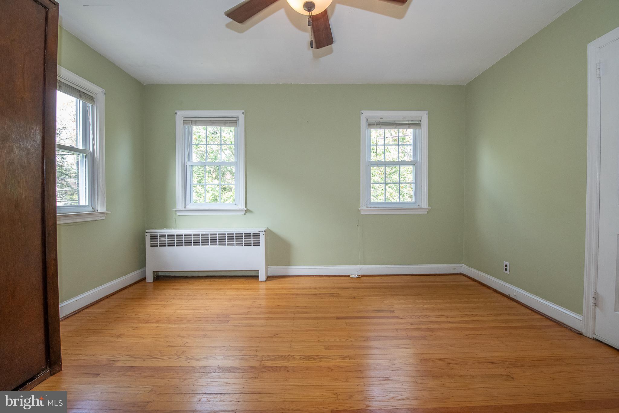 1454 Manoa Road Wynnewood, PA 19096 - Photo 25 of 41 a view of an empty room with wooden floor and a window