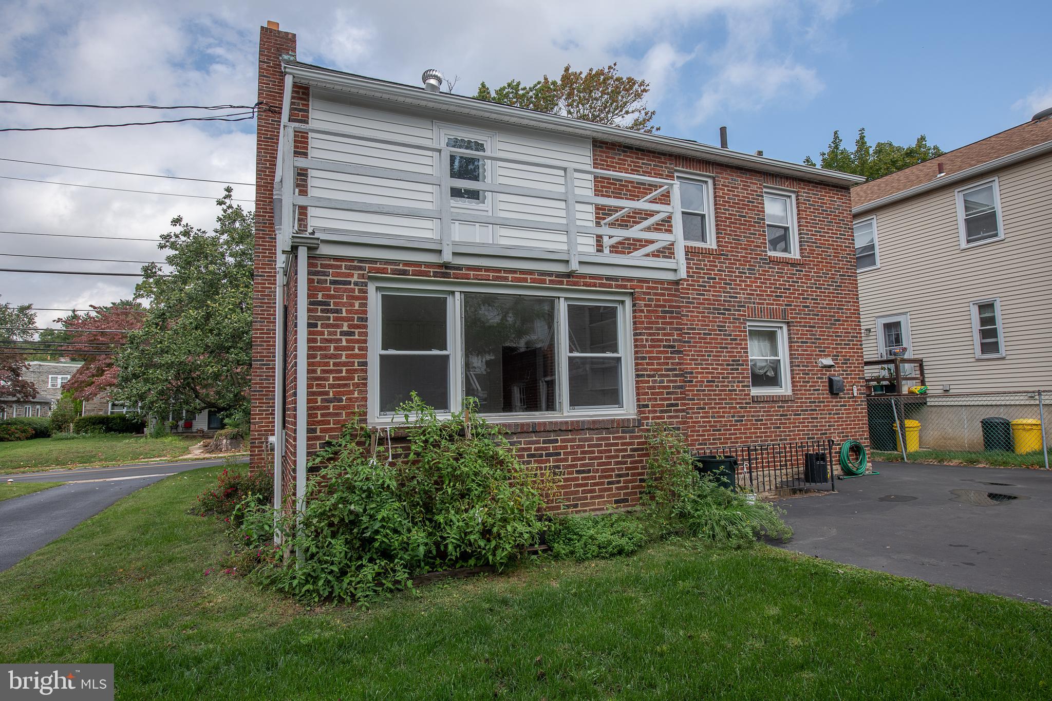 1454 Manoa Road Wynnewood, PA 19096 - Photo 38 of 41 a front view of a house with garden
