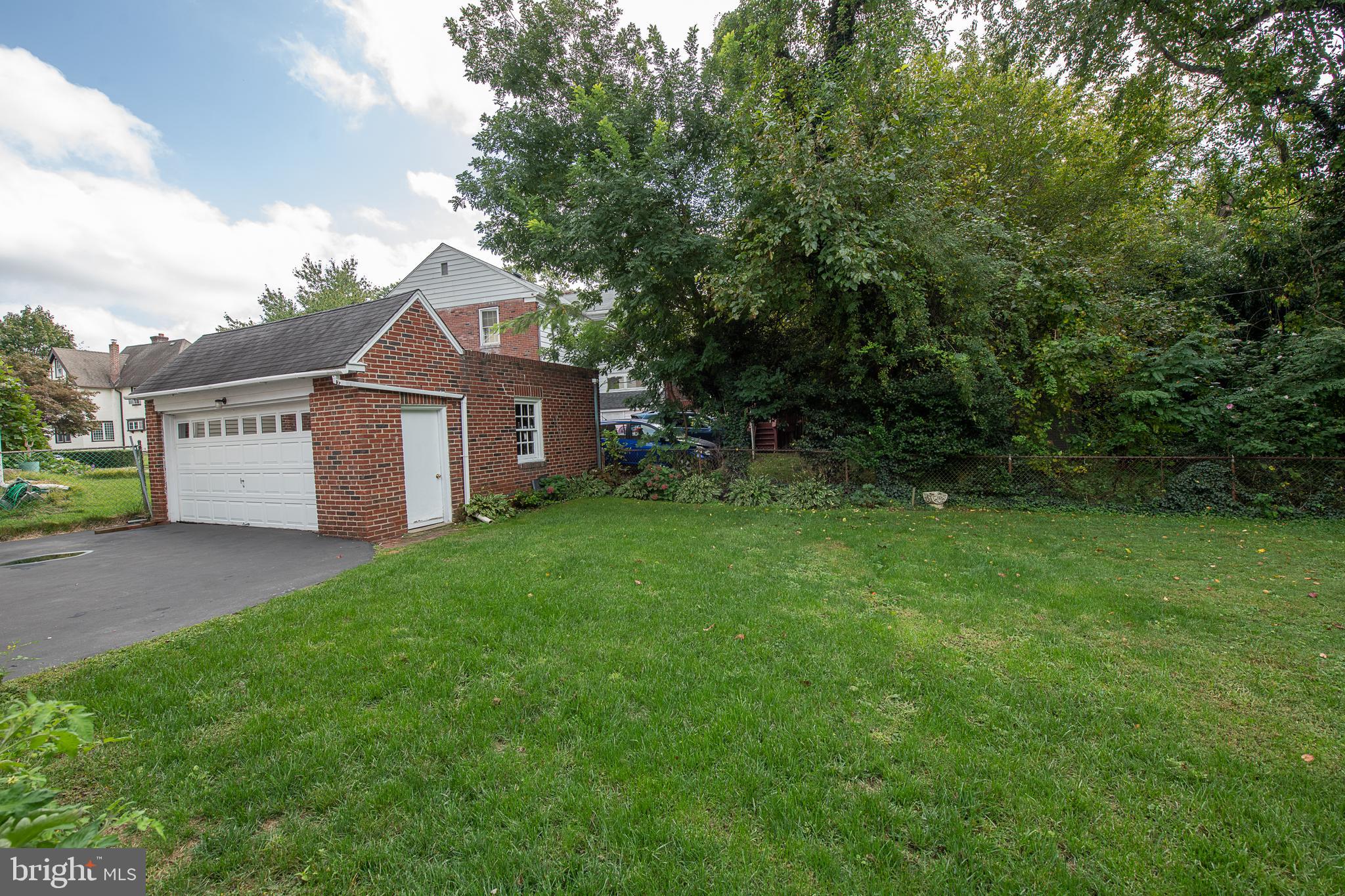 1454 Manoa Road Wynnewood, PA 19096 - Photo 40 of 41 a front view of a house with a garden