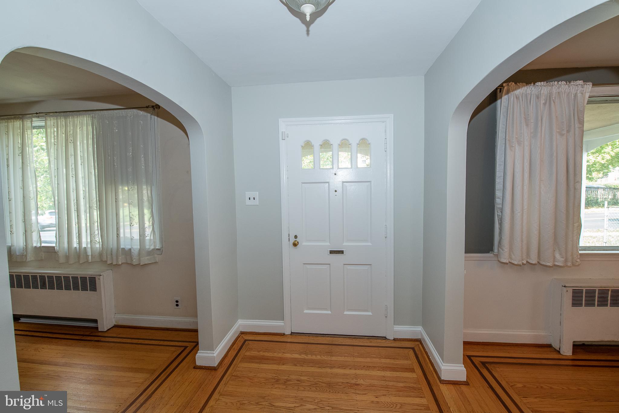 1454 Manoa Road Wynnewood, PA 19096 - Photo 5 of 41 a view of a livingroom with wooden floor and a window