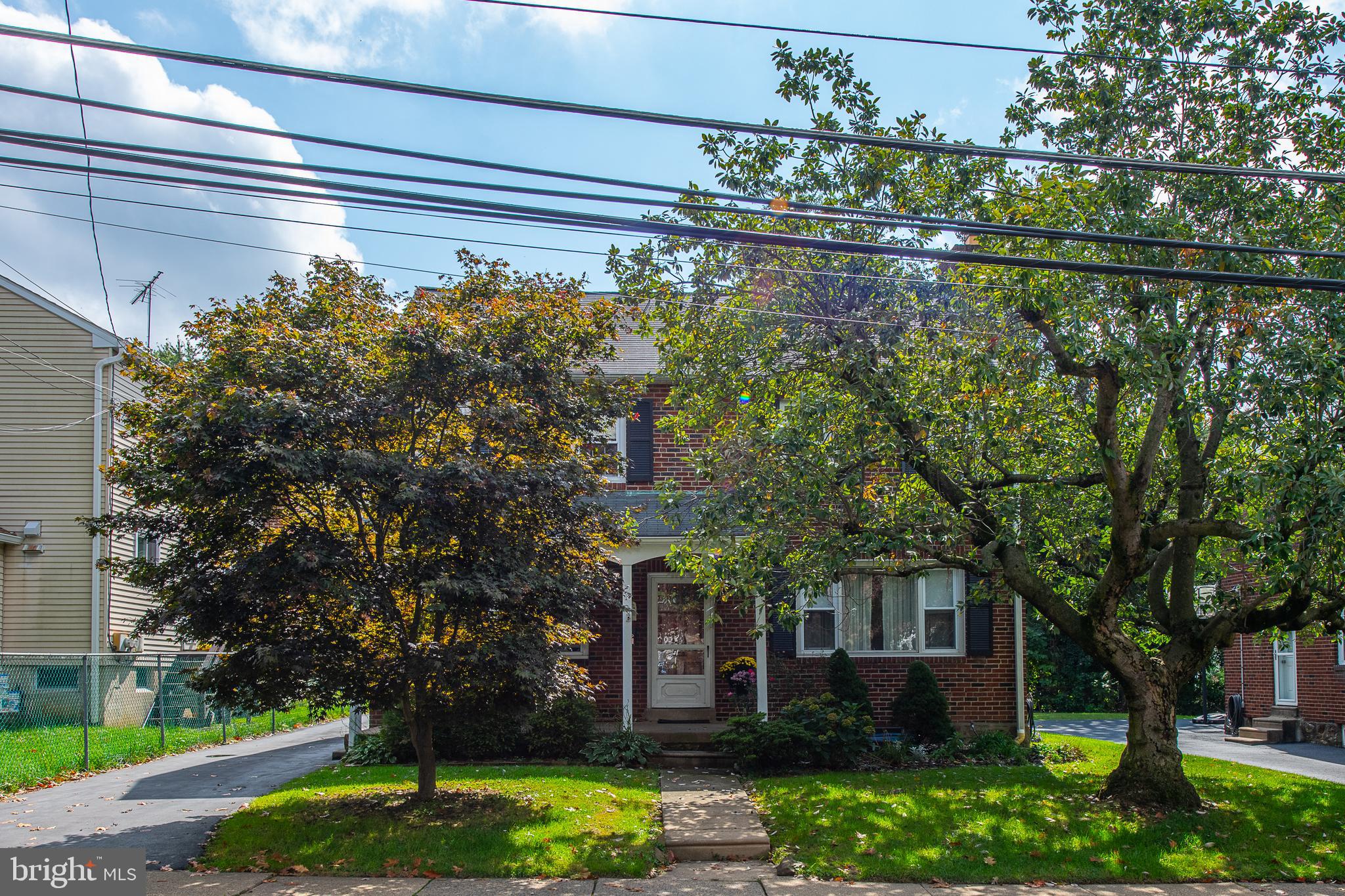 1454 Manoa Road Wynnewood, PA 19096 - Photo 41 of 41 a front view of a house with garden