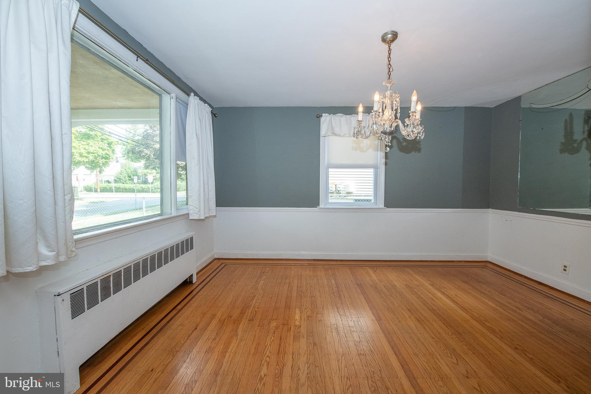 1454 Manoa Road Wynnewood, PA 19096 - Photo 7 of 41 a view of a room with wooden floor chandelier and a window