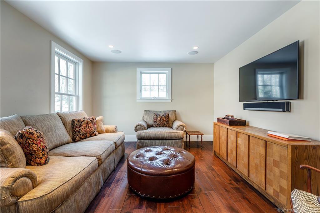 104 Lower Church Hill Road Washington, CT 06794 - Photo 12 of 23 a living room with furniture and a flat screen tv