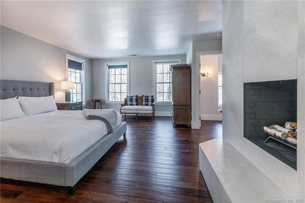 104 Lower Church Hill Road Washington, CT 06794 - Photo 14 of 23 a spacious bedroom with a bed and a couch