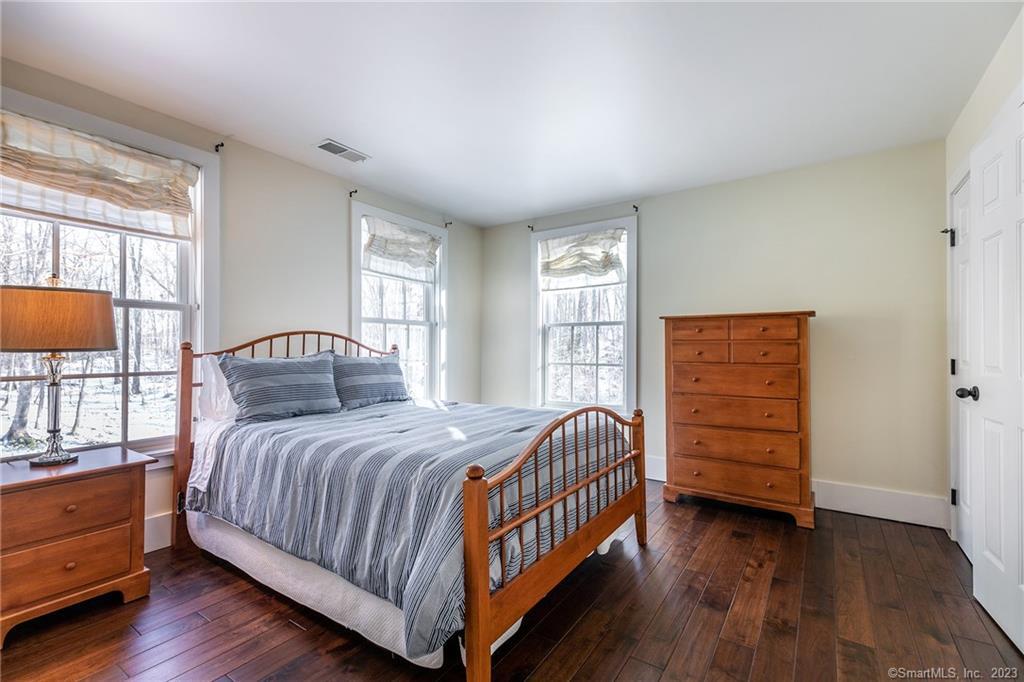 104 Lower Church Hill Road Washington, CT 06794 - Photo 19 of 23 a bedroom with a bed and a dresser