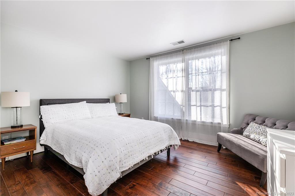 104 Lower Church Hill Road Washington, CT 06794 - Photo 21 of 23 a bedroom with a bed and a window