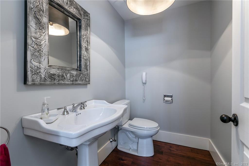 104 Lower Church Hill Road Washington, CT 06794 - Photo 9 of 23 a bathroom with a toilet sink and mirror