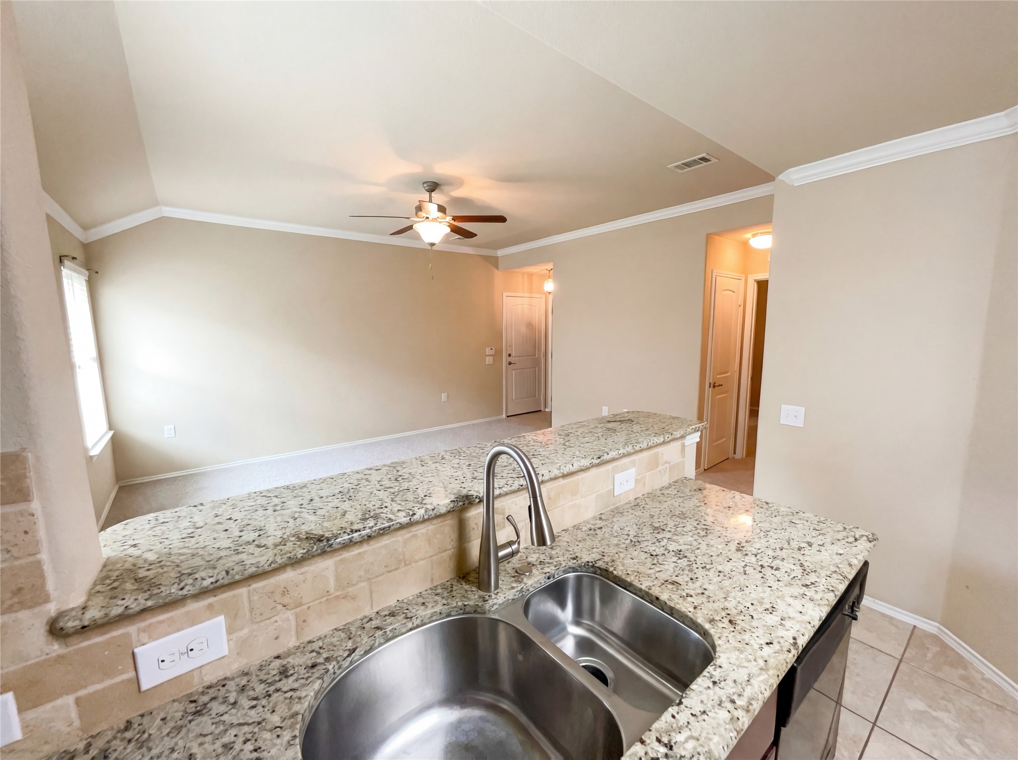 7208 Outfitter Drive Austin, TX 78744 - Photo 21 of 34 a kitchen with a sink and a mirror
