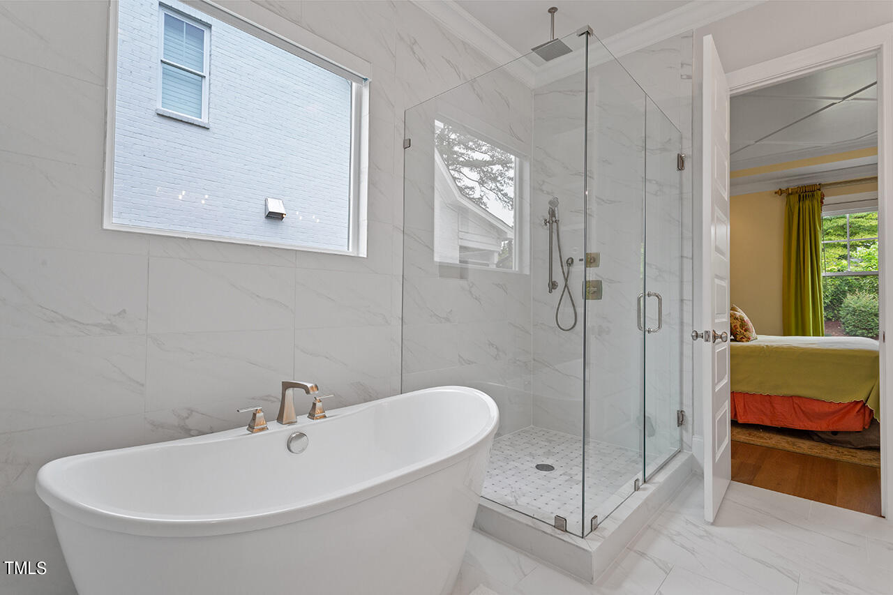 913 Canterbury Road Raleigh, NC 27607 - Photo 18 of 36 a bathroom with a shower and a sink