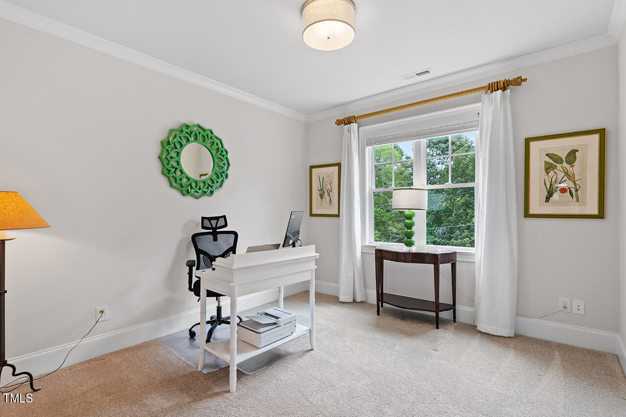 913 Canterbury Road Raleigh, NC 27607 - Photo 22 of 36 a room with furniture and window