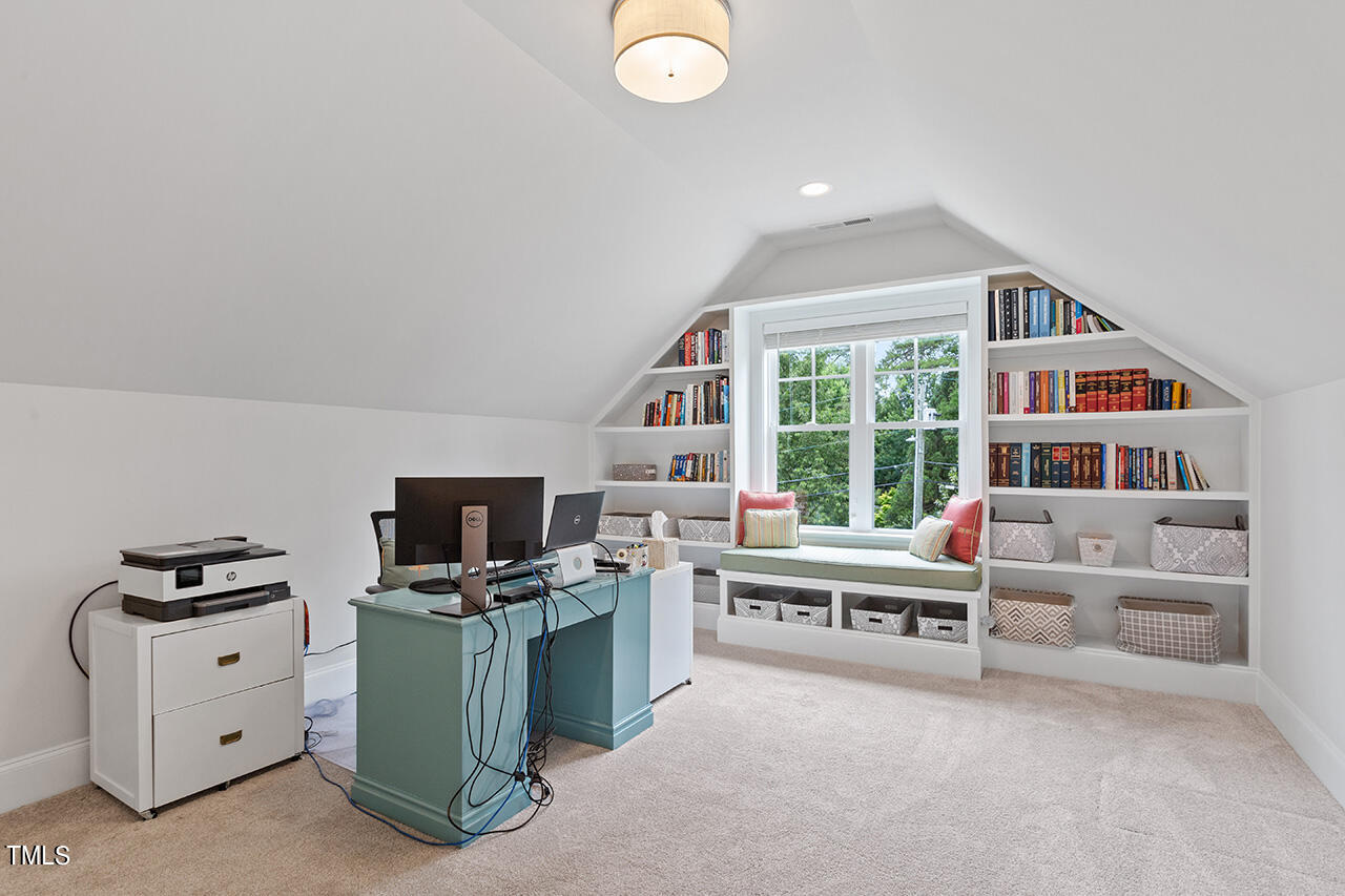 913 Canterbury Road Raleigh, NC 27607 - Photo 23 of 36 a room with furniture and a flat screen tv
